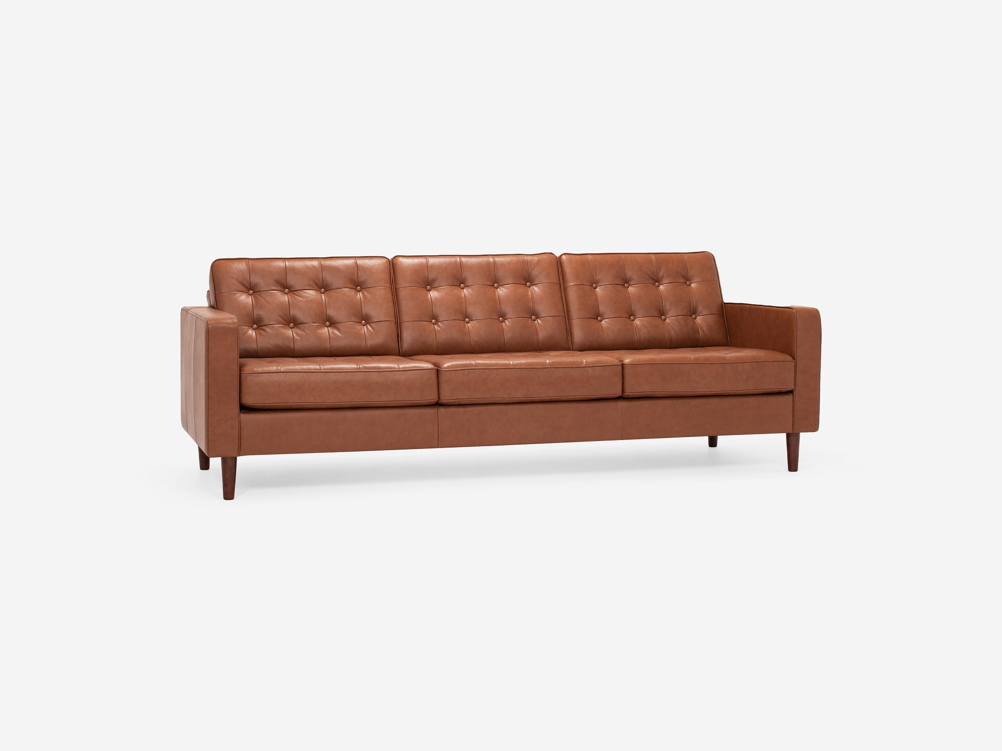 Corner view of our mid century modern sofa, the Reverie 92", upholstered in red brown leather